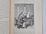 an open book with a picture of a man sitting at a table