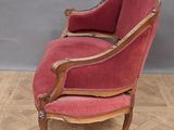 an old chair with red upholstered upholstered upholstered upholstered upholstered up