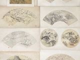 several old chinese paper fans with drawings on them on a table