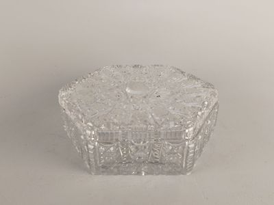 an image of a clear glass candle holder on a white surface