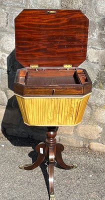 a wooden box sitting on a stand with a wooden top