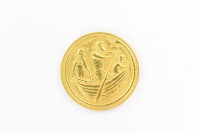 une image représentant une pièce d'or sur laquelle figurent un bateau et des fleurs