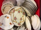 a red box full of plates and bowls in it