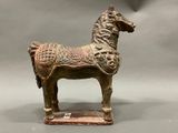 a statue of a horse that is standing on a table