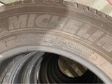 tires are lined up and ready to be used in a tire shop