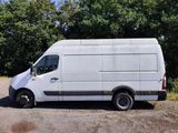 a white van that is parked on the side of the road