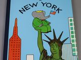 a book with a picture of the statue of liberty on it