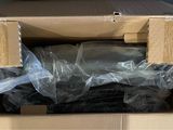 a cardboard box with a bunch of clothes inside of it