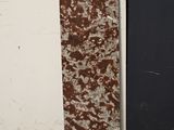 a skateboard leaning up against a wall in a room