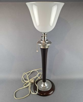 a lamp that is sitting on a table next to a cord