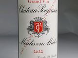 a bottle of wine that is sitting on a table