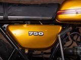 a close up of a yellow motorcycle parked in a garage