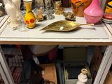a table with a lot of vases and other items on it