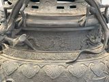 a large gray vase with a dragon on it