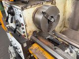 a machine that is working on a piece of metal