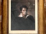 portrait d'un homme en manteau noir, dans un cadre doré