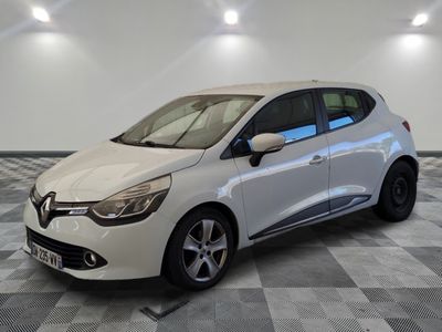 the white car is parked on a checkered tile floor