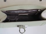 a purse that is open on a white table