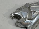 a close up of a metal object on a white surface