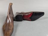 a pair of shoes that are next to each other on the floor