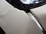 a close up of a car ' s headlight and front bumper