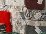 a lot of clothes that are sitting on a table