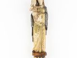 a statue of a woman holding a child in her arms