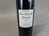 a bottle of wine that is sitting on a table