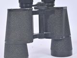 a close up of a pair of binoculars on a white surface