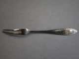 spoon and fork on a table with a white background