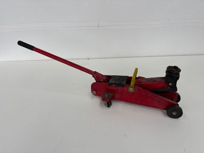 an image of a red jack on a white surface