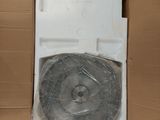 a toilet in a cardboard box with a plastic lid