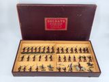 a box with a lot of toy soldiers in it