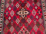 an oriental rug with a red and blue design on a white background