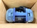 a blue and black toy car inside of a cardboard box