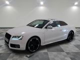 an image of a white audi car in a showroom