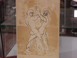 un dessin représentant deux hommes en train de lutter dans une vitrine
