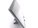 a tablet computer sitting on a stand on a white surface