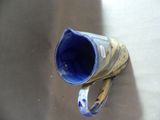 a blue and white vase sitting on a table