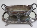 a silver tray with a mirror on top of it