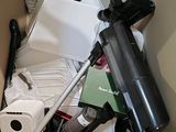 a cardboard box filled with assorted items and a camera