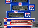 a lot of toy trains that are stacked on top of each other