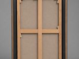 a wooden frame with a window in the middle of it