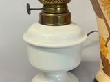 a lamp that is sitting on a table next to a vase