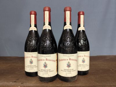four bottles of wine are lined up on a wooden table