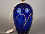 an image of a blue vase with a gold swirl on it