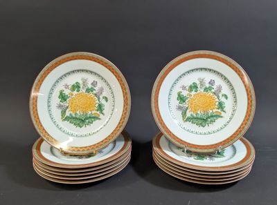 six plates with yellow and green designs are stacked on top of each other