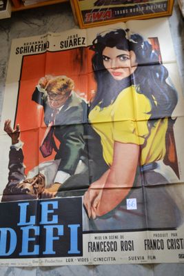 a large poster of a woman in a yellow shirt on a wall
