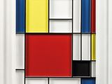 a white frame with a red, yellow, blue and black painting on it