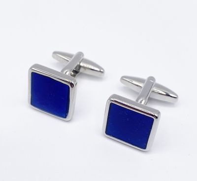 two pairs of cufflinks with blue enamel on them